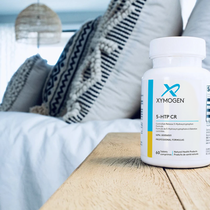 Bottle of XYMOGEN 5-HTP CR on table